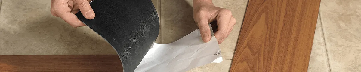 A professional installing vinyl flooring in Bellevue, WA